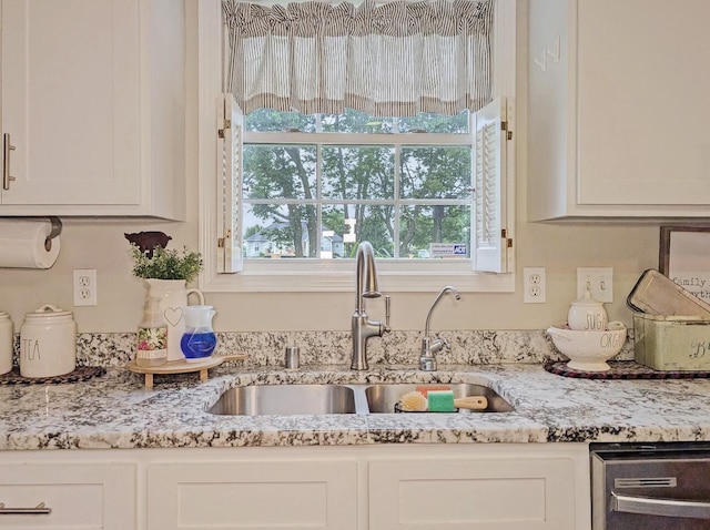 109 Edwards Ct, Lancaster, KY 40444 - kitchen with white cabinets, light stone counters, and dishwasher