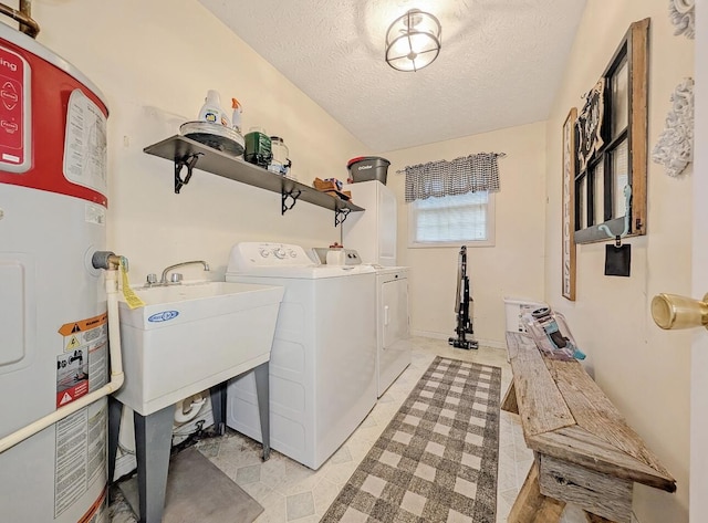 109 Edwards Ct, Lancaster, KY 40444 - laundry room with electric water heater, washer and clothes dryer, and a textured ceiling