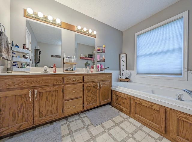 109 Edwards Ct, Lancaster, KY 40444 - full bath featuring a garden tub, vanity, a textured ceiling, and tile patterned floors