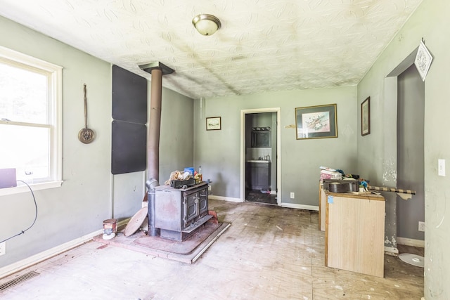 30 Country Ln, Prestonsburg, KY 41653 - interior space with a wood stove and baseboards