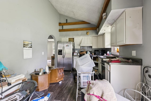 30 Country Ln, Prestonsburg, KY 41653 - kitchen featuring stainless steel fridge, arched walkways, dark wood-style floors, tasteful backsplash, and black microwave
