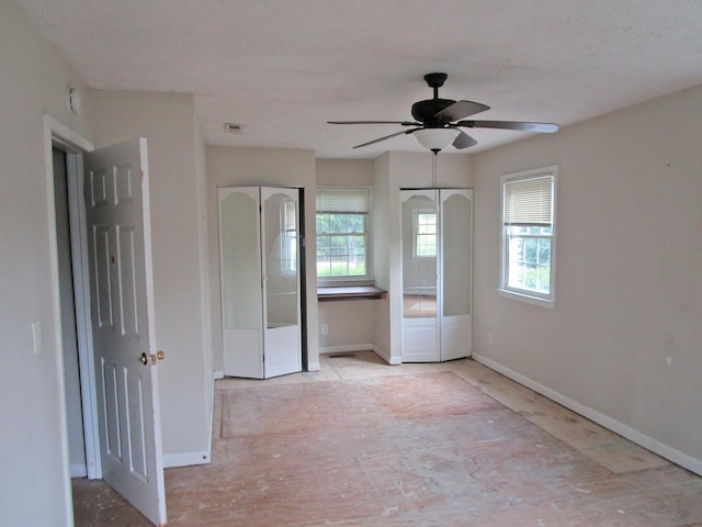 4000 Shadrick Ferry Rd, Frankfort, KY 40601 - unfurnished bedroom with multiple windows, multiple closets, and a ceiling fan