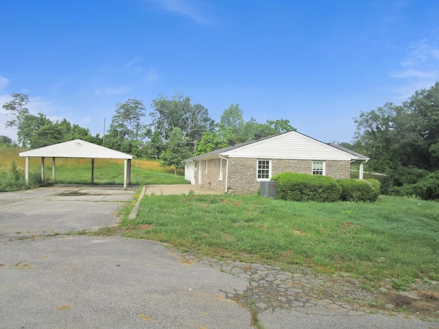 4000 Shadrick Ferry Rd, Frankfort, KY 40601 - view of home's exterior with concrete driveway, a carport, and a lawn