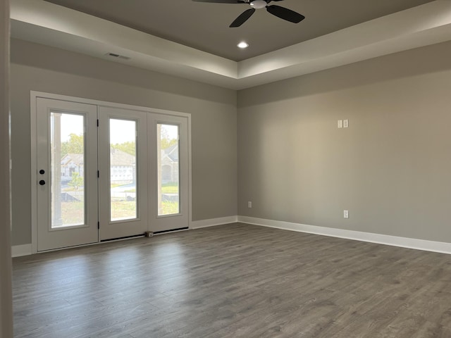 108 Aetna, Georgetown, KY 40324 - empty room with dark wood finished floors, a ceiling fan, recessed lighting, and a tray ceiling