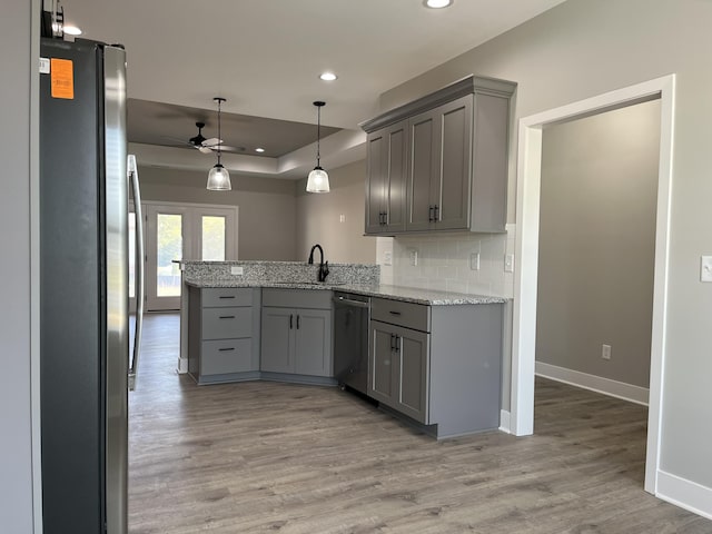 108 Aetna, Georgetown, KY 40324 - kitchen featuring stainless steel appliances, gray cabinetry, ceiling fan, a peninsula, and light wood-type flooring