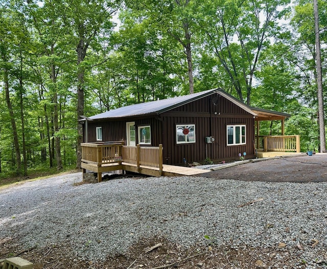 449 Johns Rd, Jabez, KY 42544 - rustic home with board and batten siding and a deck