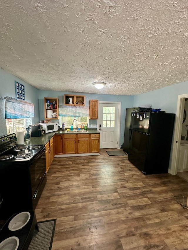 449 Johns Rd, Jabez, KY 42544 - kitchen with black appliances, dark countertops, brown cabinetry, a textured ceiling, and open shelves