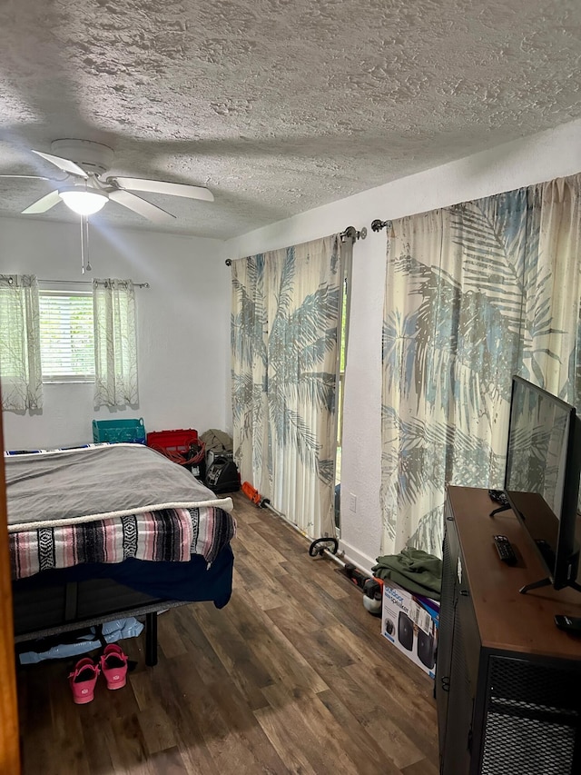 449 Johns Rd, Jabez, KY 42544 - bedroom featuring wood finished floors, ceiling fan, and a textured ceiling