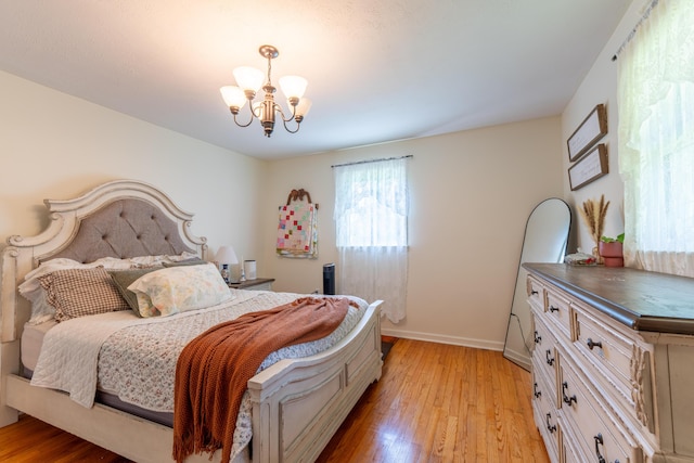 1462 Lily Rd, London, KY 40744 - bedroom with a chandelier and light wood finished floors