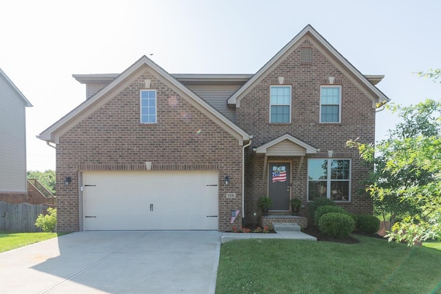 126 Mollie Way, Georgetown, KY 40324 - traditional home with brick siding, concrete driveway, and a garage