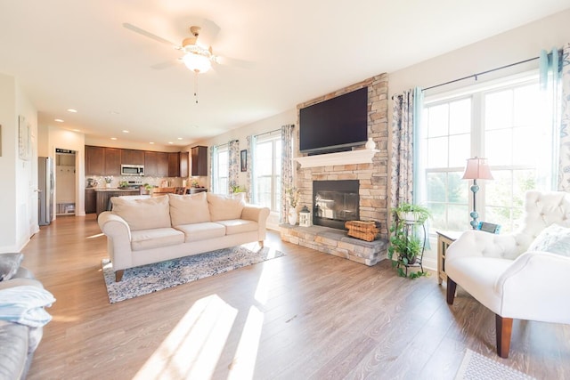 126 Mollie Way, Georgetown, KY 40324 - living area with ceiling fan, light wood-type flooring, a fireplace, and recessed lighting