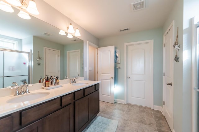 126 Mollie Way, Georgetown, KY 40324 - bathroom with double vanity, a stall shower, and a chandelier