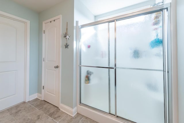 126 Mollie Way, Georgetown, KY 40324 - bathroom with a stall shower and baseboards