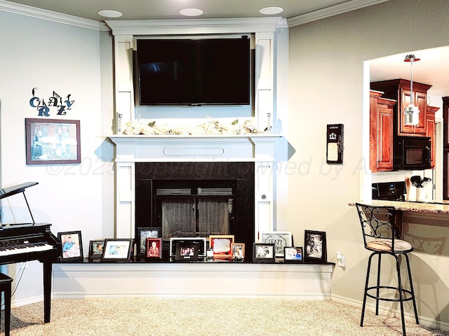 living room with baseboards, carpet floors, crown molding, and a fireplace