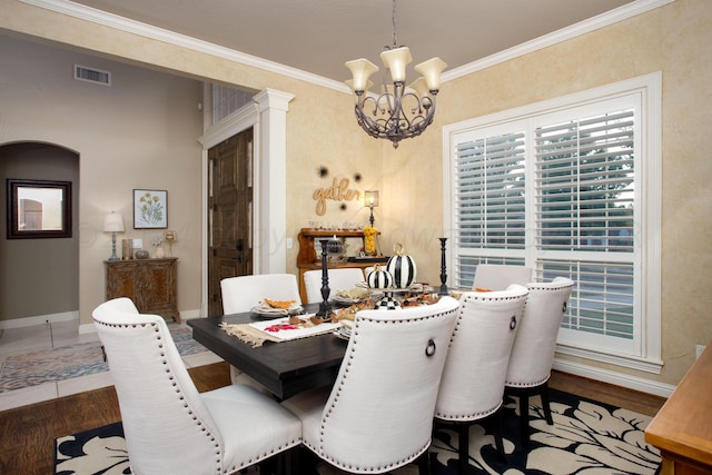 7705 New England Pkwy, Amarillo, TX 79119 - dining room featuring visible vents, wood finished floors, ornamental molding, and a notable chandelier