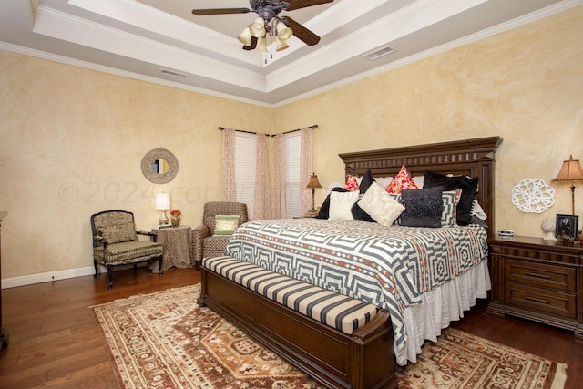 7705 New England Pkwy, Amarillo, TX 79119 - bedroom with a raised ceiling, visible vents, and hardwood / wood-style flooring