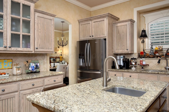7705 New England Pkwy, Amarillo, TX 79119 - kitchen with stainless steel refrigerator with ice dispenser, tasteful backsplash, ornamental molding, and a sink