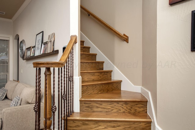 7705 New England Pkwy, Amarillo, TX 79119 - stairway featuring visible vents, arched walkways, and crown molding