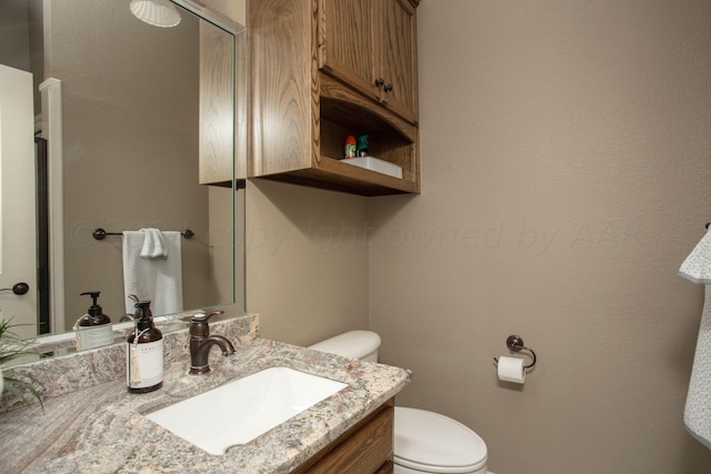 7705 New England Pkwy, Amarillo, TX 79119 - bathroom with vanity and toilet