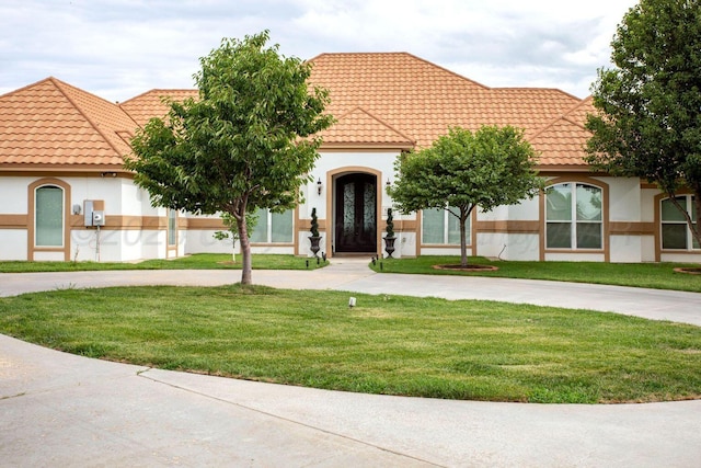 6106 Purple Sage Cir, Amarillo, TX 79124 - view of front of house featuring a front yard, stucco siding, and a tiled roof