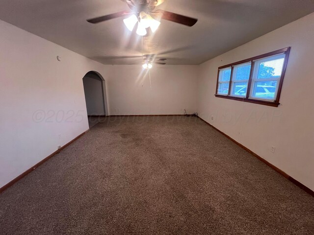 109 Ranger St, Hereford, TX 79045 - carpeted spare room featuring ceiling fan, arched walkways, and baseboards