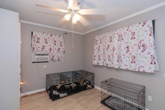 miscellaneous room with ornamental molding, cooling unit, hardwood / wood-style flooring, and ceiling fan