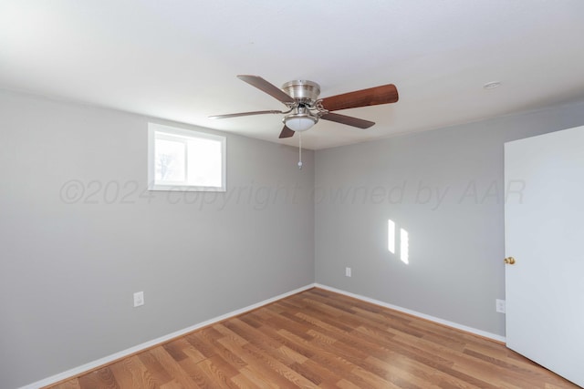 unfurnished room featuring light wood-type flooring and ceiling fan