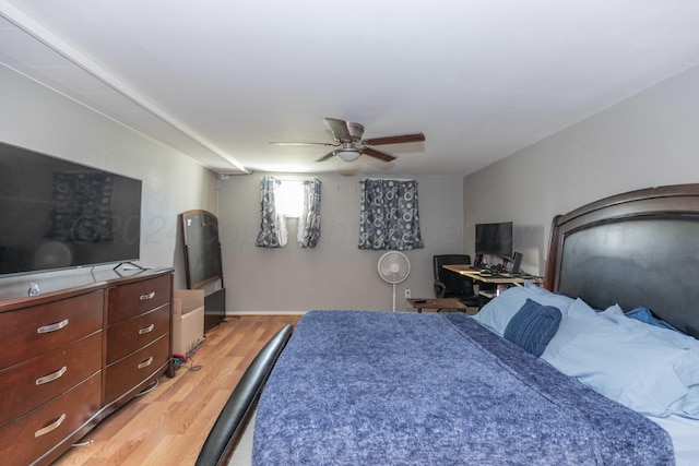 bedroom with wood-type flooring and ceiling fan