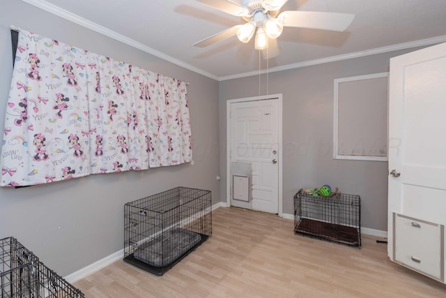 entrance foyer with ceiling fan, light wood-type flooring, and ornamental molding