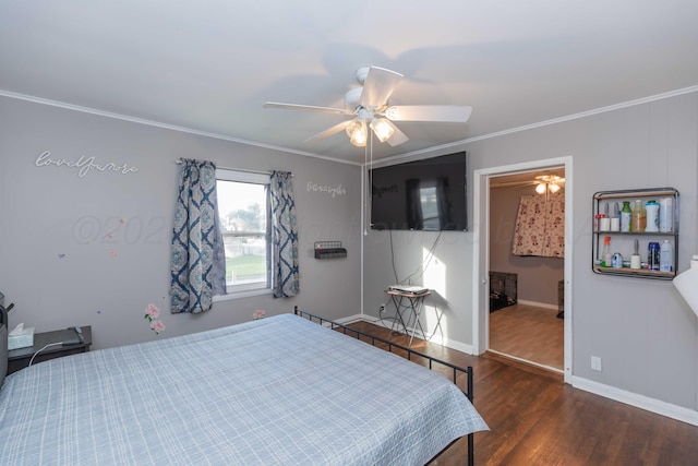 bedroom featuring ceiling fan, ensuite bath, dark hardwood / wood-style flooring, and ornamental molding