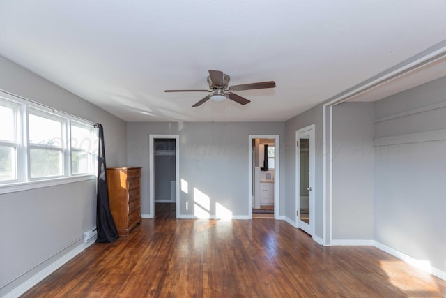 unfurnished bedroom featuring dark hardwood / wood-style flooring and ceiling fan