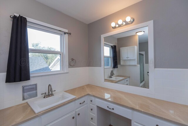 bathroom with vanity and backsplash