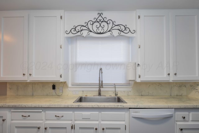 kitchen featuring white cabinetry, tasteful backsplash, sink, and white dishwasher