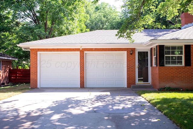 3203 S Austin St, Amarillo, TX 79109 - view of front of home featuring concrete driveway, brick siding, an attached garage, and a shingled roof