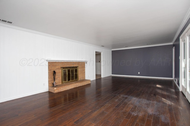 3203 S Austin St, Amarillo, TX 79109 - unfurnished living room featuring ornamental molding, wood finished floors, and a brick fireplace