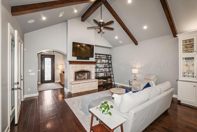 6817 Baccus Dr, Amarillo, TX 79124 - living area with beamed ceiling, baseboards, a ceiling fan, a fireplace, and dark wood finished floors