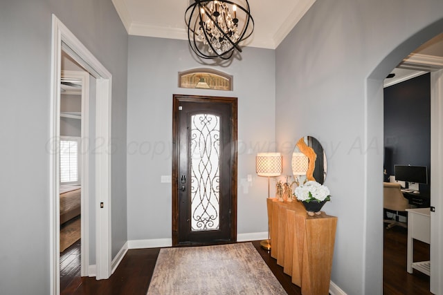 6817 Baccus Dr, Amarillo, TX 79124 - entryway with arched walkways, ornamental molding, wood finished floors, a chandelier, and baseboards