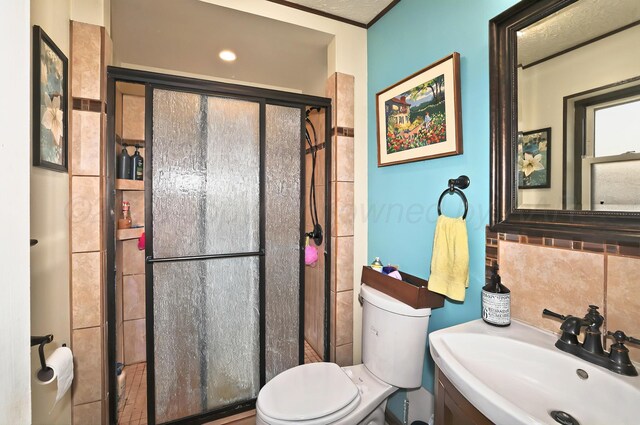 6005 Gainsborough Rd, Amarillo, TX 79106 - full bath with toilet, a stall shower, backsplash, and vanity
