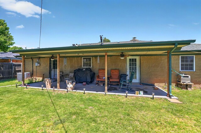 6005 Gainsborough Rd, Amarillo, TX 79106 - back of property featuring a ceiling fan, a patio, and brick siding