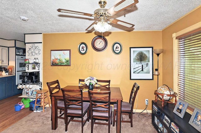 6005 Gainsborough Rd, Amarillo, TX 79106 - dining area with ceiling fan, a textured ceiling, baseboards, and wood finished floors