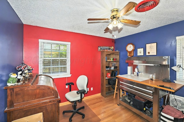 6005 Gainsborough Rd, Amarillo, TX 79106 - office space featuring wood finished floors, a ceiling fan, a textured ceiling, and baseboards