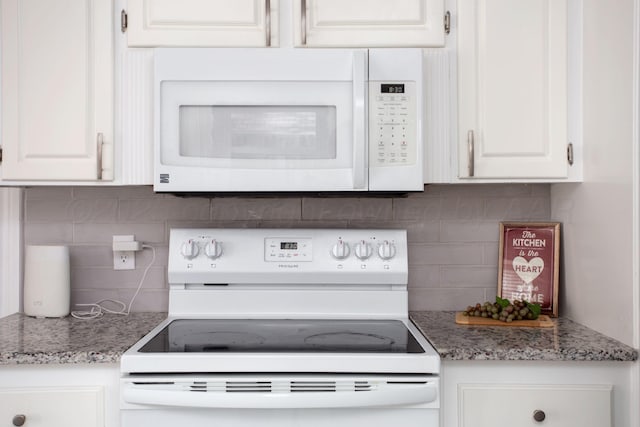 3925 Gatewood St, Amarillo, TX 79109 - kitchen with white appliances, backsplash, and white cabinetry