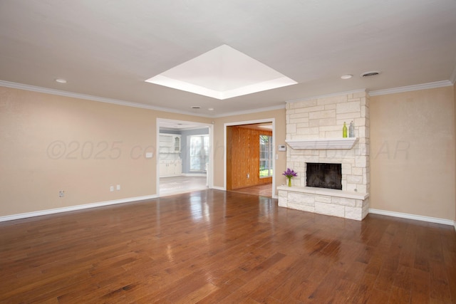 3925 Gatewood St, Amarillo, TX 79109 - unfurnished living room featuring a stone fireplace, baseboards, wood finished floors, visible vents, and ornamental molding