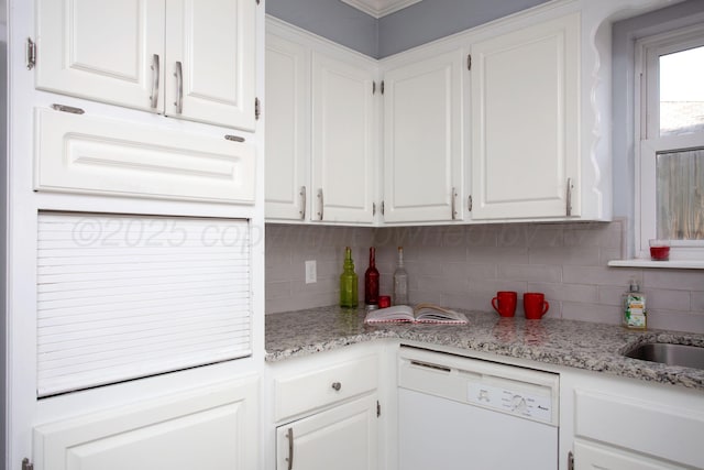 3925 Gatewood St, Amarillo, TX 79109 - kitchen with white dishwasher, light stone counters, tasteful backsplash, and white cabinetry