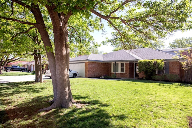 3925 Gatewood St, Amarillo, TX 79109 - ranch-style house with an attached garage, a front lawn, and brick siding