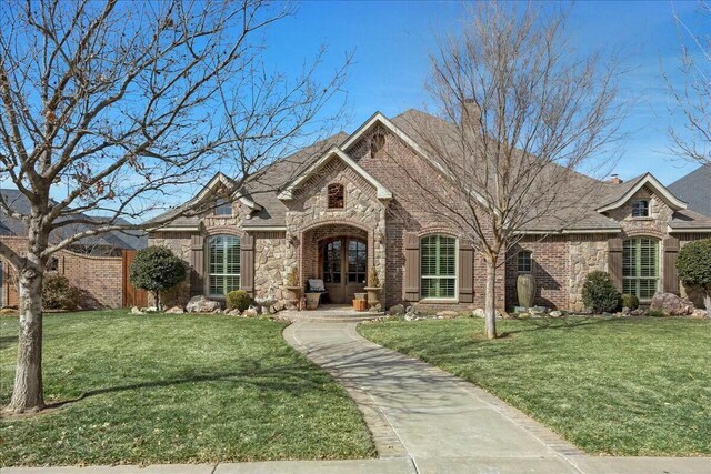 7908 London Ct, Amarillo, TX 79119 - view of front of house featuring stone siding, brick siding, and a front lawn