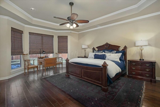 7908 London Ct, Amarillo, TX 79119 - bedroom featuring crown molding, a raised ceiling, baseboards, and dark wood-style floors