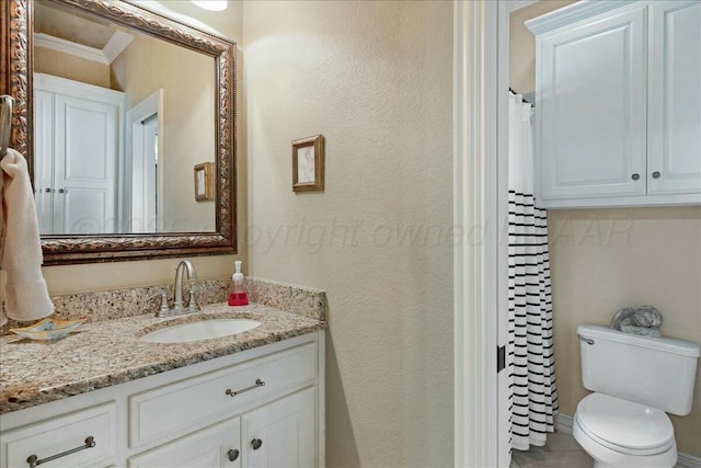 7908 London Ct, Amarillo, TX 79119 - bathroom with toilet, vanity, ornamental molding, a textured wall, and a shower with shower curtain