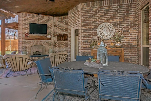 7908 London Ct, Amarillo, TX 79119 - view of patio with fence, outdoor dining area, and an outdoor brick fireplace