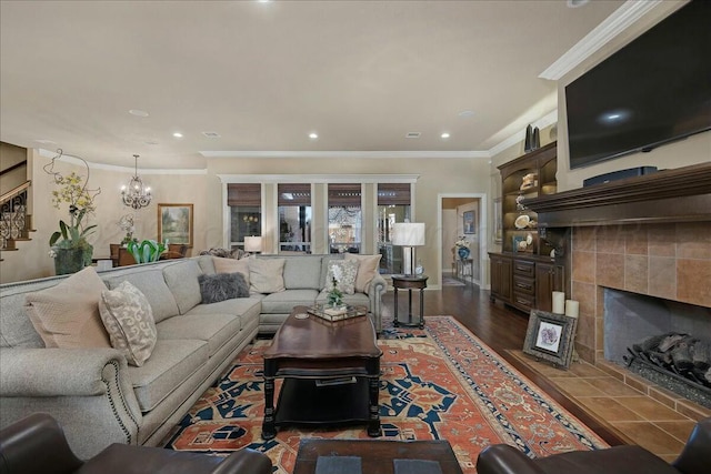 7908 London Ct, Amarillo, TX 79119 - living room featuring a chandelier, ornamental molding, recessed lighting, and a tile fireplace